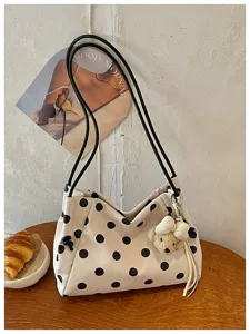 Casual beige canvas shoulder bag with classic black polka dots and cute bear pendant.