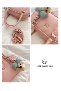 Chic pink bowling shoulder bag with cute bear pendant, stylish women casual crossbody handbag.