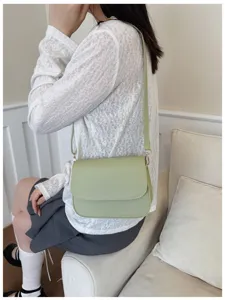 Minimalist light green crossbody bag detail, stylish single shoulder design for daily wear.
