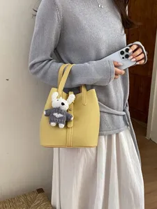 Yellow leather bucket bag for women with cute knitted bunny pendant daily shoulder handbag