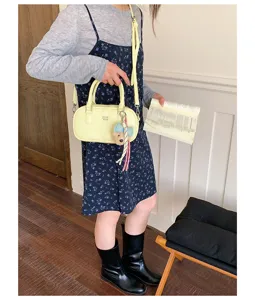 Yellow bowling shoulder bag women stylish casual PU leather handbag with cute pendant strap.