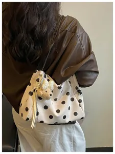 Casual polka dot shoulder bag for women, stylish large capacity tote bag for daily commute.