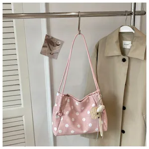 Casual pink polka dot shoulder bag for women, large capacity canvas tote bag for daily commute.