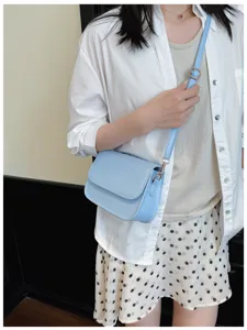 Casual versatile women light blue crossbody shoulder bag, simple summer fashion design.
