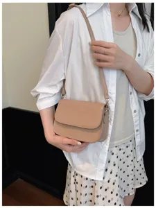 Minimalist crossbody bag detail, chic khaki shoulder bag for women daily fashion wear