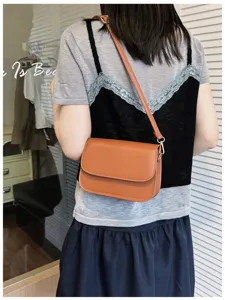 Chic minimalist brown leather shoulder bag, stylish casual crossbody purse for modern women.