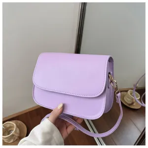 Detailed view of the stylish purple leather shoulder bag, showcasing smooth texture and hardware.
