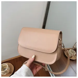 Detailed view of the elegant beige crossbody bag showing fine stitching and smooth PU leather.
