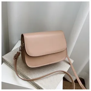 Minimalist solid beige crossbody shoulder bag for women, casual daily flap bag with strap.