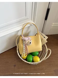 Yellow vintage style women handbag with cute bear pendant, trendy summer top handle bag details.