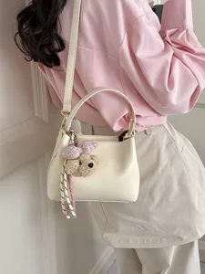 Stylish women shoulder handbag cream bucket bag casual commuter crossbody bag with cute bear charm