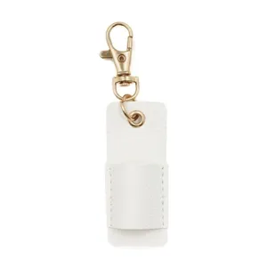 Close-up detail view of the white leather pen holder pocket with gold metal keyring clasp.