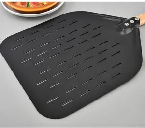 Detailed shot of a 12 inch perforated pizza peel with black painted aluminum and wooden handle.
