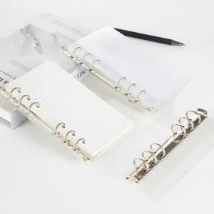 Transparent PVC loose leaf binder mechanism with grid paper inner pages for daily planning.
