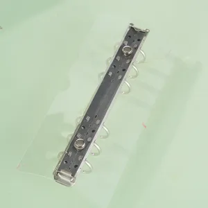 Detailed view of clear PVC 6-ring loose leaf binder mechanism board for handmade planner.