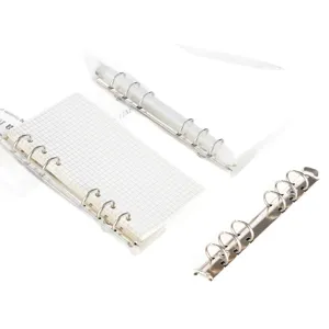 Loose leaf binder mechanisms with clear PVC dividers and grid paper for handmade notebooks.