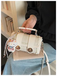 Stylish tweed Boston shoulder bag for women, chic commuting crossbody bag with cute plush charm.