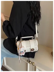 Chic plaid shoulder crossbody bag for women, trendy contrast design with cute plush charm.