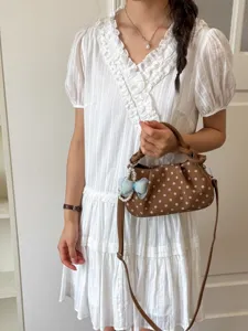 Sweet polka dot crossbody bag for women, stylish shoulder handbag for summer commute daily.