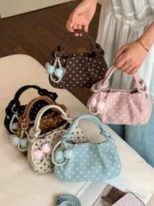 Sweet polka dot handbag for women, stylish shoulder crossbody bag with pearl bow charm.