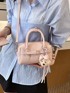 Chic pink women's Boston shoulder crossbody handbag with cute bear charm for summer.