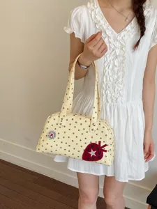 Sac bandoulière Boston élégant à motif de pattes jaunes pour femmes, fourre-tout chic.