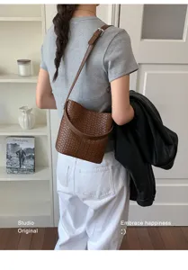 Stylish brown woven leather bucket bag for women, chic shoulder crossbody hobo handbag daily.