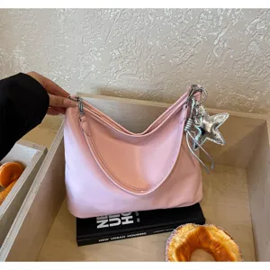 Pink minimalist shoulder tote bag with silver star charm, elegant everyday commuter purse.