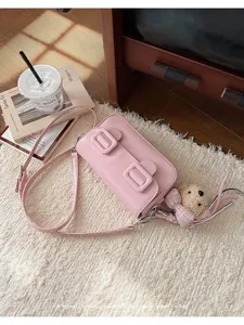 Chic pink PU leather crossbody bag for women, elegant small square bag with cute bear pendant.
