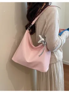 Classic pink hobo shoulder bag with a silver star pendant, casual tote design for daily commute.
