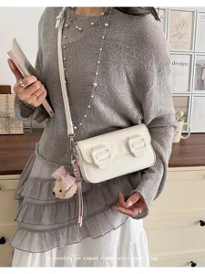 Chic elegant vintage style women shoulder and crossbody bag with sweet cute charm pendant.