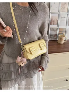 Yellow PU leather vintage women shoulder crossbody bag with cute bear pendant for daily wear.