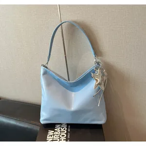 Casual light blue shoulder bag for women, stylish hobo tote bag with silver star pendant.