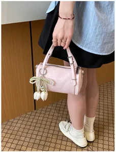 Chic pink pillow shoulder bag for women, stylish crossbody bag with pearl tulip pendant.