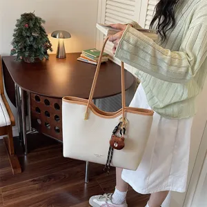 Detailed shot of large capacity women tote bag, stylish summer casual shoulder bag.