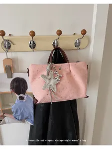 Stylish pink large capacity women tote shoulder bag featuring a charming star pendant detail.
