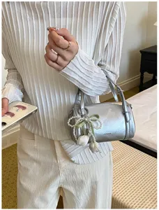 Chic silver pillow shoulder bag with pearl tulip charm, stylish Korean fashion crossbody.