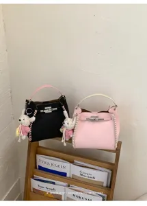 Women contrast color lychee texture woven handbag with cute bunny charm detail and metal lock.