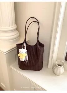 Korean minimalist woven leather tote bag with cute bear charm, stylish large capacity bag.