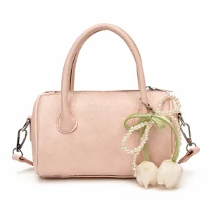 Chic pink pillow bag for women with pearl tulip charm, stylish handbag for summer daily use.