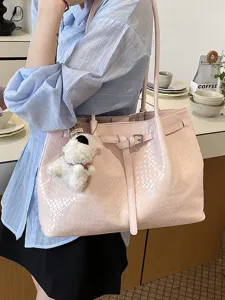 Pink woven leather tote bag for women, large capacity shoulder handbag, casual commuter style chic.