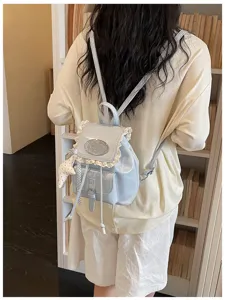 Light blue college style small backpack with lace trim and cute star charm for daily travel.