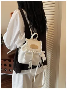 Sweet college style white leather backpack with delicate lace trim and cute star pendant for girls.
