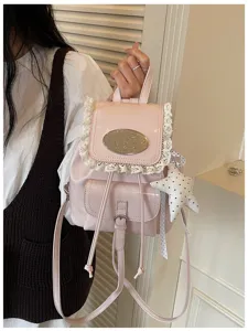 Pink cute PU leather backpack with lace trim, metallic plate and front pocket details.