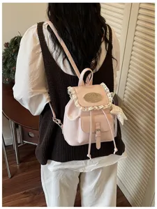 Sweet pink mini backpack with delicate lace trim, ideal for cute daily casual travel outfits.