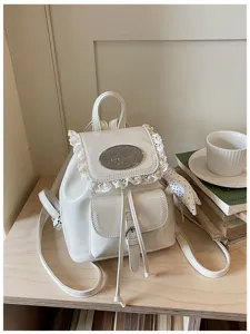 Sweet style white PU leather mini backpack featuring delicate lace trim, ideal for daily travel.