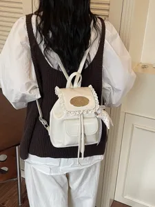 White mini backpack with delicate lace trim, cute casual daypack for women, stylish travel bag.