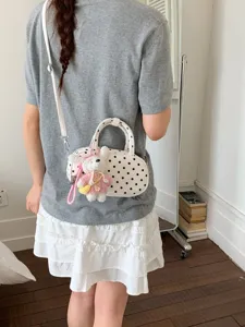 Korean style polka dot crossbody bag sweet bowling handbag with cute plush rabbit pendant.
