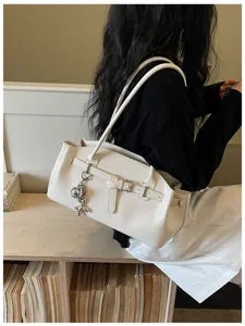 White textured leather shoulder bag for women, stylish commuting handbag with belt buckle.