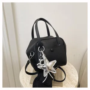 Black leather handbag casual tote bag shoulder crossbody bag with silver star charm.